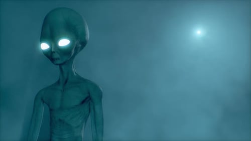 Scary gray alien standing and blinking at the dark foggy background of a moon-like planet