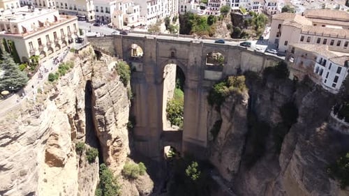Historic Stone Bridge Spanning Deep Limestone Gorge In Ancient Spain
