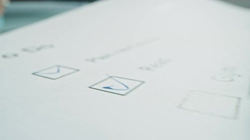 Person Ticks Checkbox Marks with a Pen, filling up To Do List. Checking Marks and FIlling in a Task