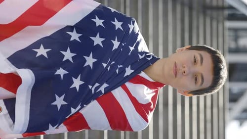 Vertical Video Portrait of Attractive Woman Proudly Representing Her Country and Putting USA Flag on
