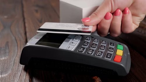 Closeup of Paying an Invoice or a Purchase with a Credit Card