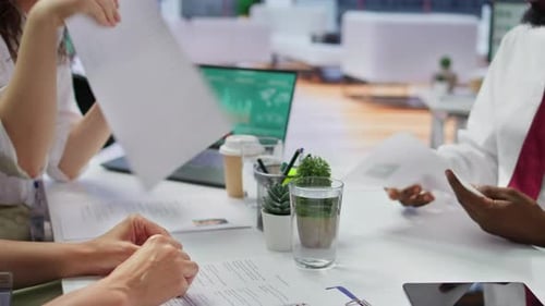 Job Candidate Hands Over His CV to Team of HR Professionals to Start Interview