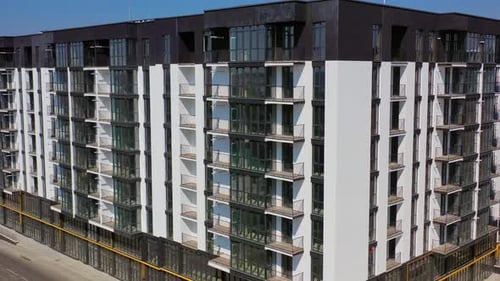 New architecture in the city. Luxury design of apartment building in a sunny day.