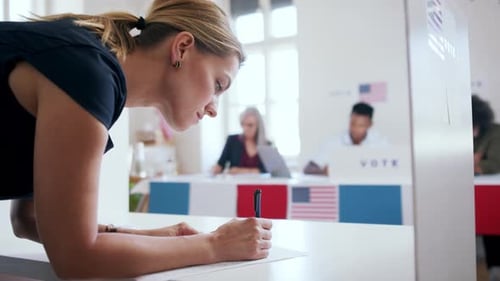 Young woman voter at polling place in the United States for USA elections