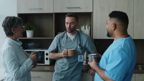 Hospital Workers Having Tea Break in Staff Room