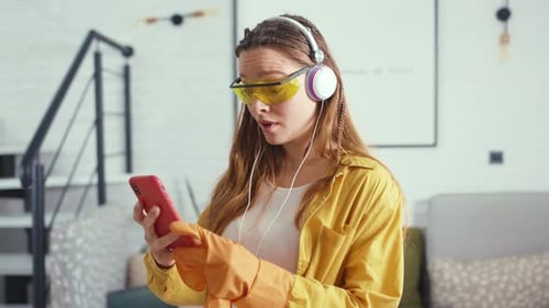 Young Woman Remove Glasses Use Phone Feel Wonder While Cleaning the Floor at Home Apartment Hygiene