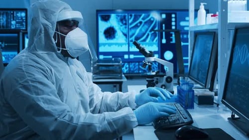 AfricanAmerican Doctor is Doing a Science Experiments and Developing Vaccine in a Modern Laboratory