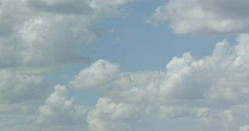 Clouds Moving Across Blue Sky During Daytime