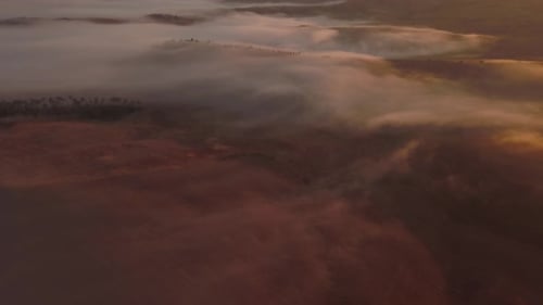 Aerial View of Fog Shrouded Hills at Sunrise