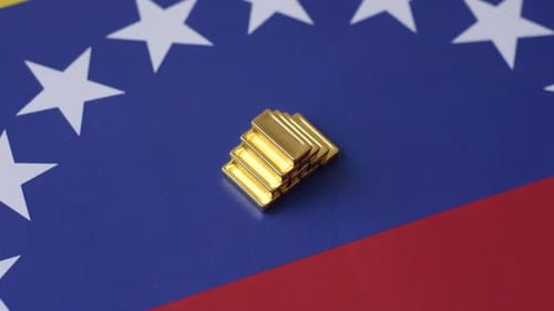 Gold Bars Stacked on Venezuelan Flag, Financial Theme