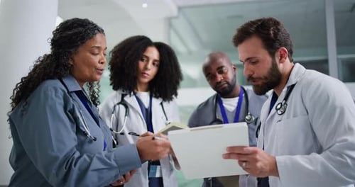 Clipboard, discussion and group of doctors in hospital for collaboration on medical diagnosis