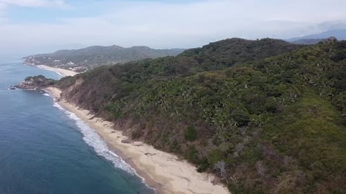 Aerial drone clip high up above Playa Malpaso paradise beach and jungle in Nayarit, Mexico