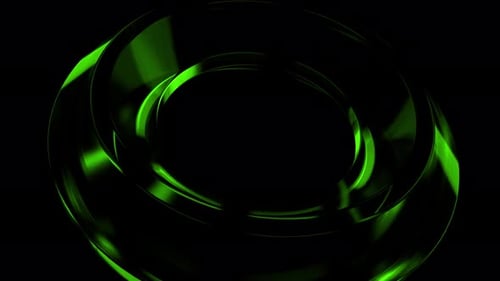 Green metallic torus rotating on black background