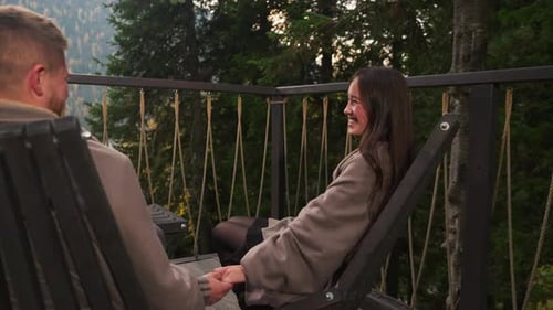 Couple Laughs Together on Hotel Terrace