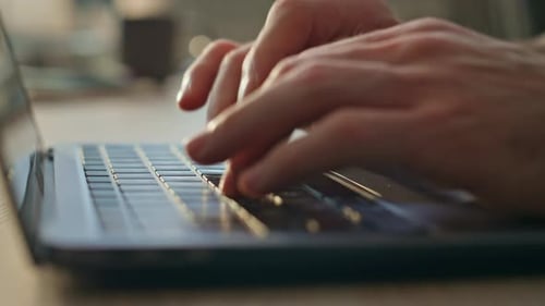 Man Hands Typing Laptop Keyboard Searching Internet in Office Desk Close Up