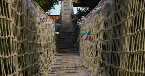 Close view Himalayan sidewalk, deep in nature Skywalk wooden construction hitting by strong wind tr