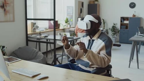 Developer in Wheelchair with VR Headset Browsing Internet in Augmented Reality