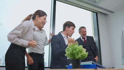 Group of young attractive business people working in office workplace.