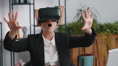 Woman Using VR Headset in Modern Office