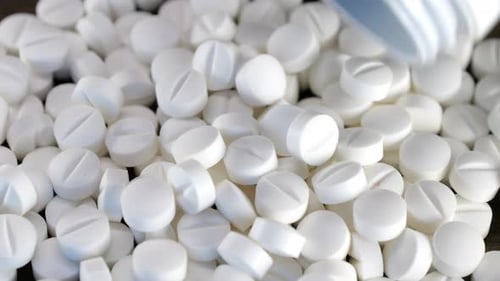 Pills Being Poured: White Medication Close Up