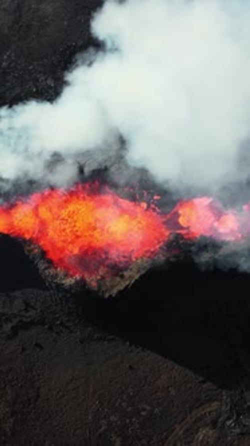 Vertical Screen Volcano Eruption in 2023 Red Burning Lava Erupts From the Ground in Iceland