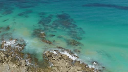 Waves Crashing Over Reef Below
