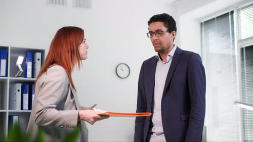 Tense Work Atmosphere Young Black Man Arguing with His Female Colleague Over Paperwork