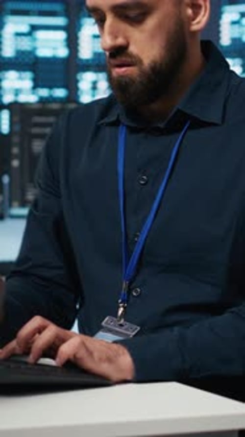 Vertical Video Computer Scientist Overseeing Server Hub Typing Code on PC