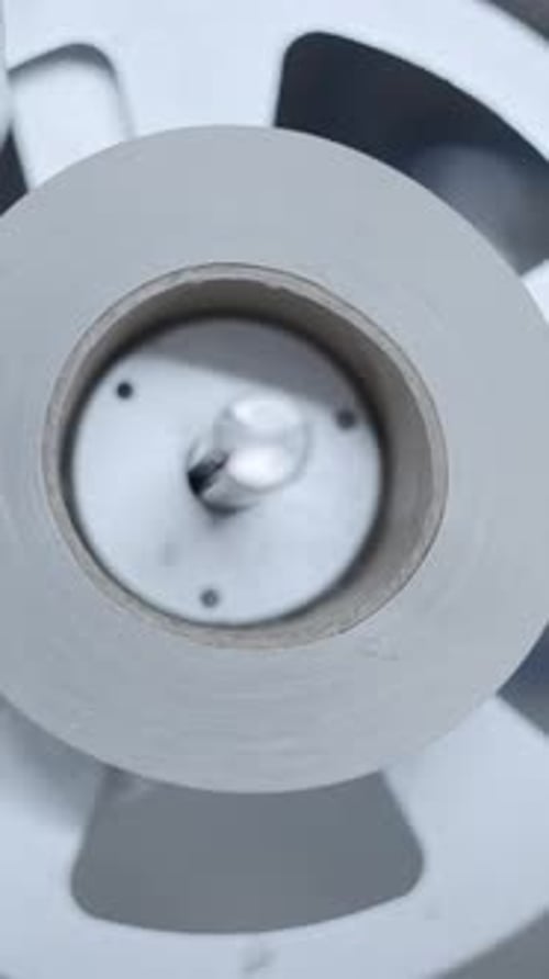 Label Plate Rolling During Labeling Of Cans In A Beer Factory Close Up