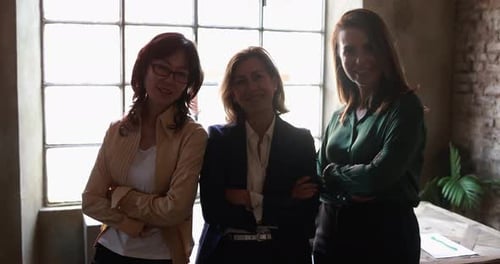 Multiethnic senior business women working together inside modern office