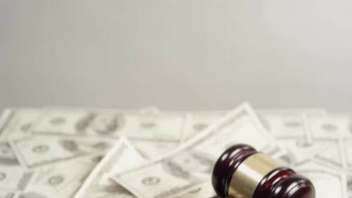 Judges Gavel Sits on Pile of Money