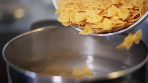 Farfalle Pasta Being Added to Boiling Water