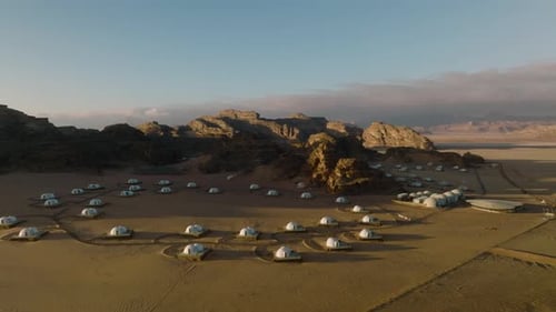 Luxury Bubble Glamping Tents On Wadi Rum Desert In Jordan At Sunset. aerial