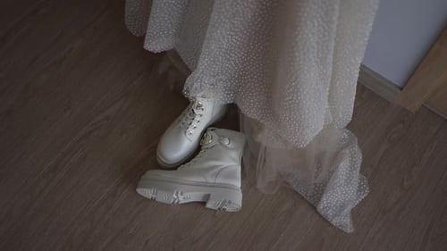 Stylish White Boots with Wedding Dress on Floor