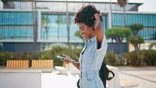 Joyful Teen Girl Messaging on Smartphone Walking City Close Up Hipster Laughing