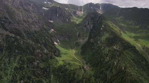 Breathtaking aerial shot of Malaiesti Valley in Bucegi Mountains, lush greenery, summer