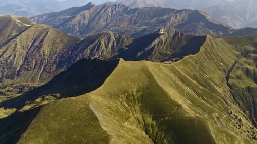 Drone Footage Of Vibrant Green And Rugged Mountain Terrain In Austria
