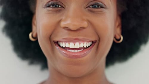 Woman Smiling Brightly in Extreme Close Up
