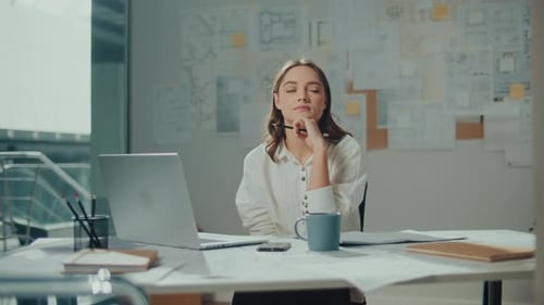 Portrait of a Young Female Architect Who is Constantly Researching New Materials