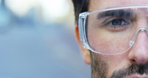 Close Up of Man Wearing Safety Glasses