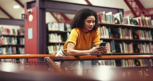 Break, college student or woman with phone in library, typing message or scroll social media to