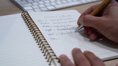 Hand Writing Content Calendar Spiral Notebook Office Desk