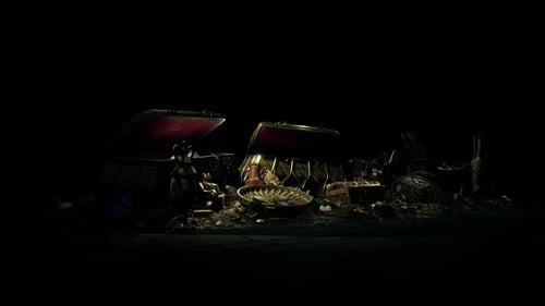 Handful of Gold Jewelry on a Dark Background