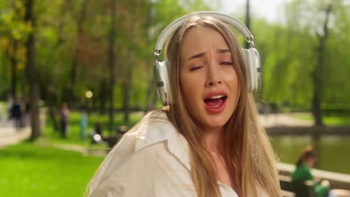 European Woman Listening Music Headphones Singing Songs Park Smiling Enjoy Joyful Female Happy Girl