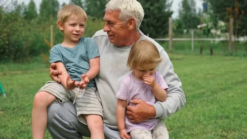 Grandfather and Grandchildren Have Fun During Walk In Park Happy Family Time Old Man Grandpa Hugging