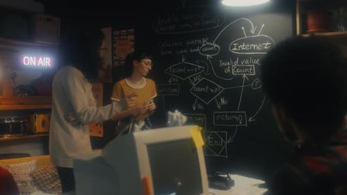 Teamwork on Tech Project in Cozy Workspace