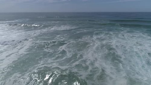 Fly over ocean water surface in Sunny Day