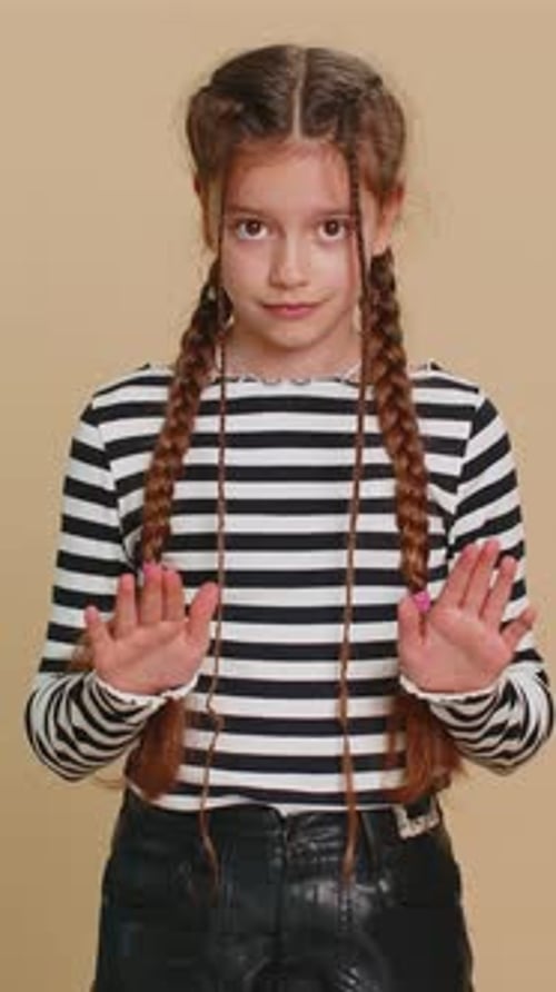 Girl in Stripes Gesturing Stop with Hands