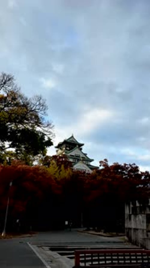 Osaka Castle Surrounded By Moat and Autumn Foliage