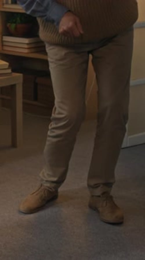 Smiling Senior Man Doing Light Exercises with Assistance